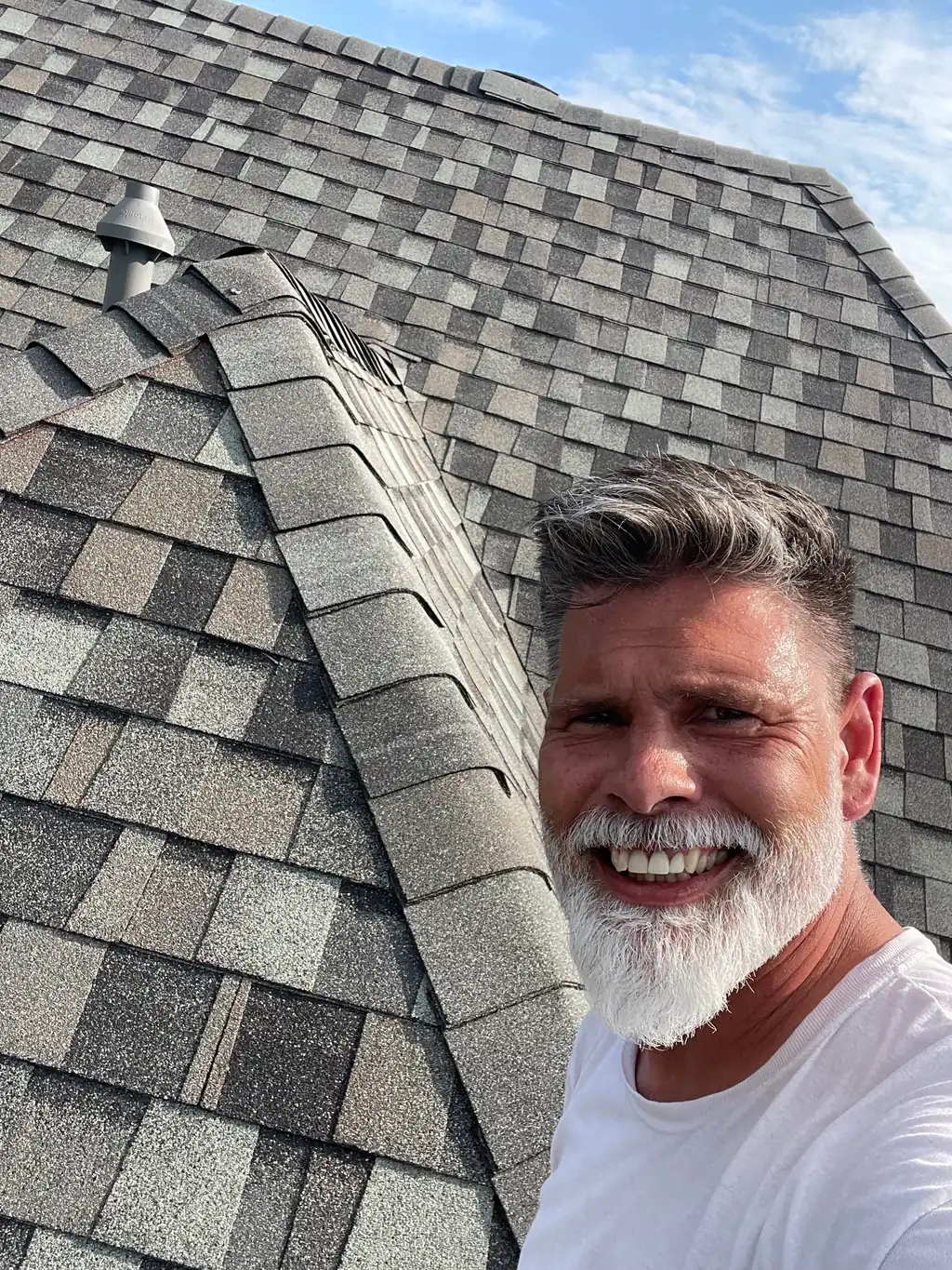 A Texas Accent roofer beside a finished ridge